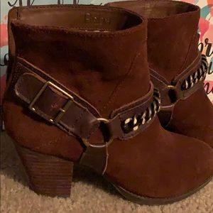 Reba boots with brass buckles